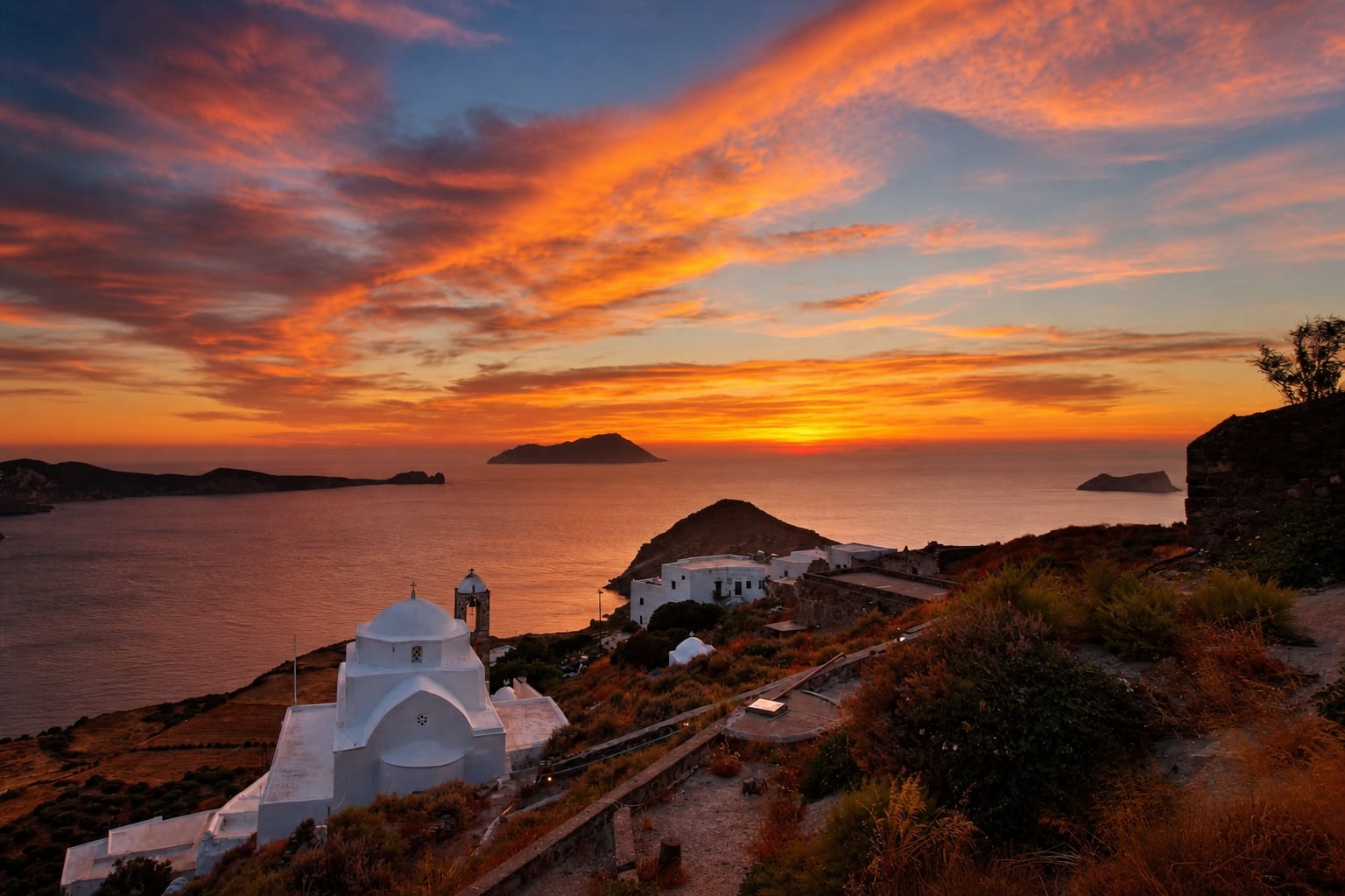 Sunset in Plaka on Milos with warm evening light.