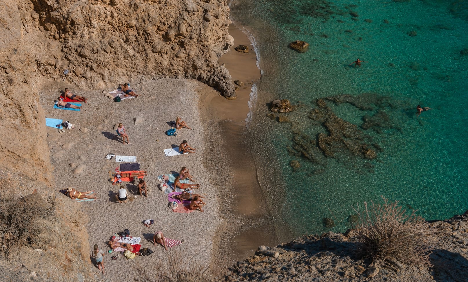 Tsigrado Beach on Milos, a scenic stop for coastal sightseeing.