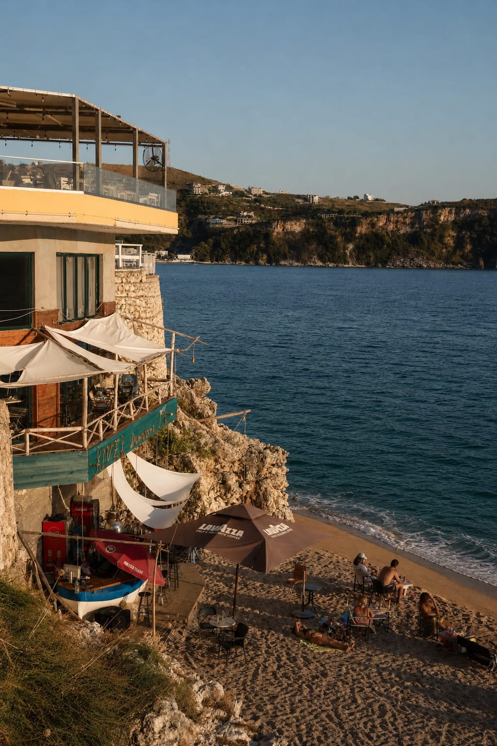 Sandy shoreline and clear water at Himare Beach in Albania