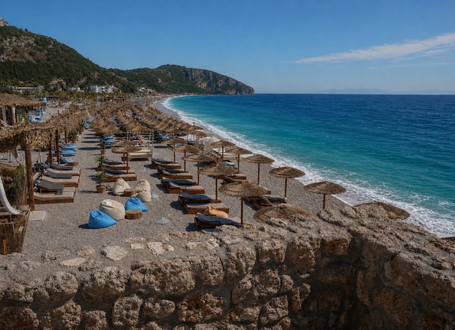 Sandy shoreline and turquoise water at Dhermi Beach in Albania