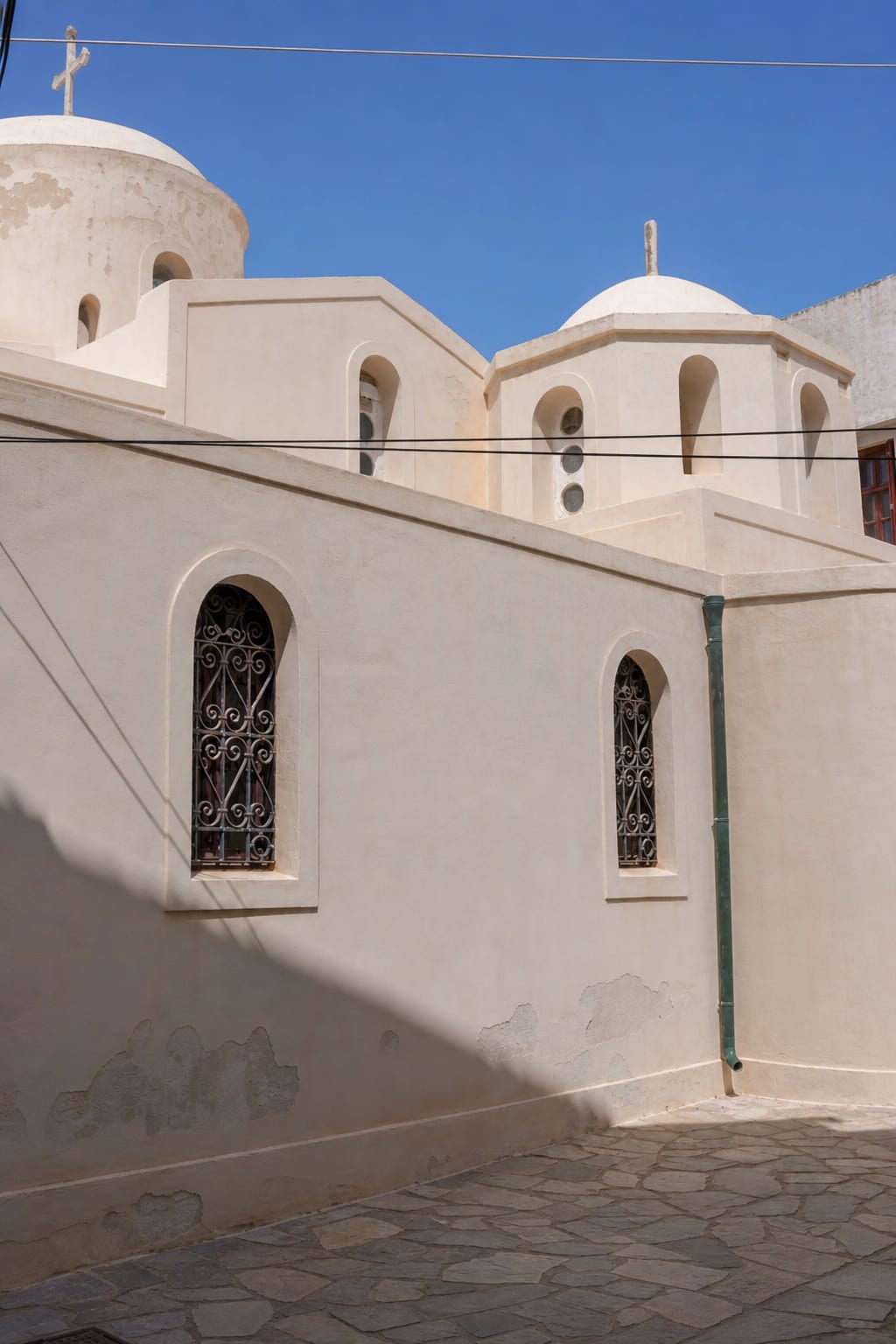 Church in Naxos Chora surrounded by traditional island architecture.