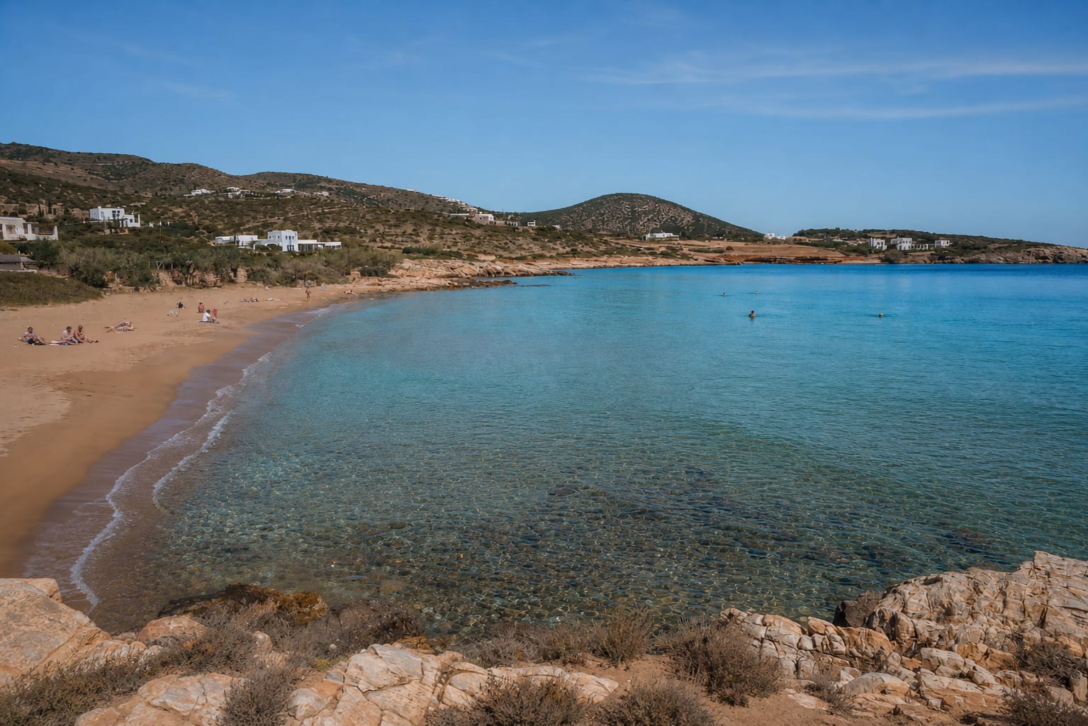 Faragas Beach in Paros with sandy shore and clear Aegean water.