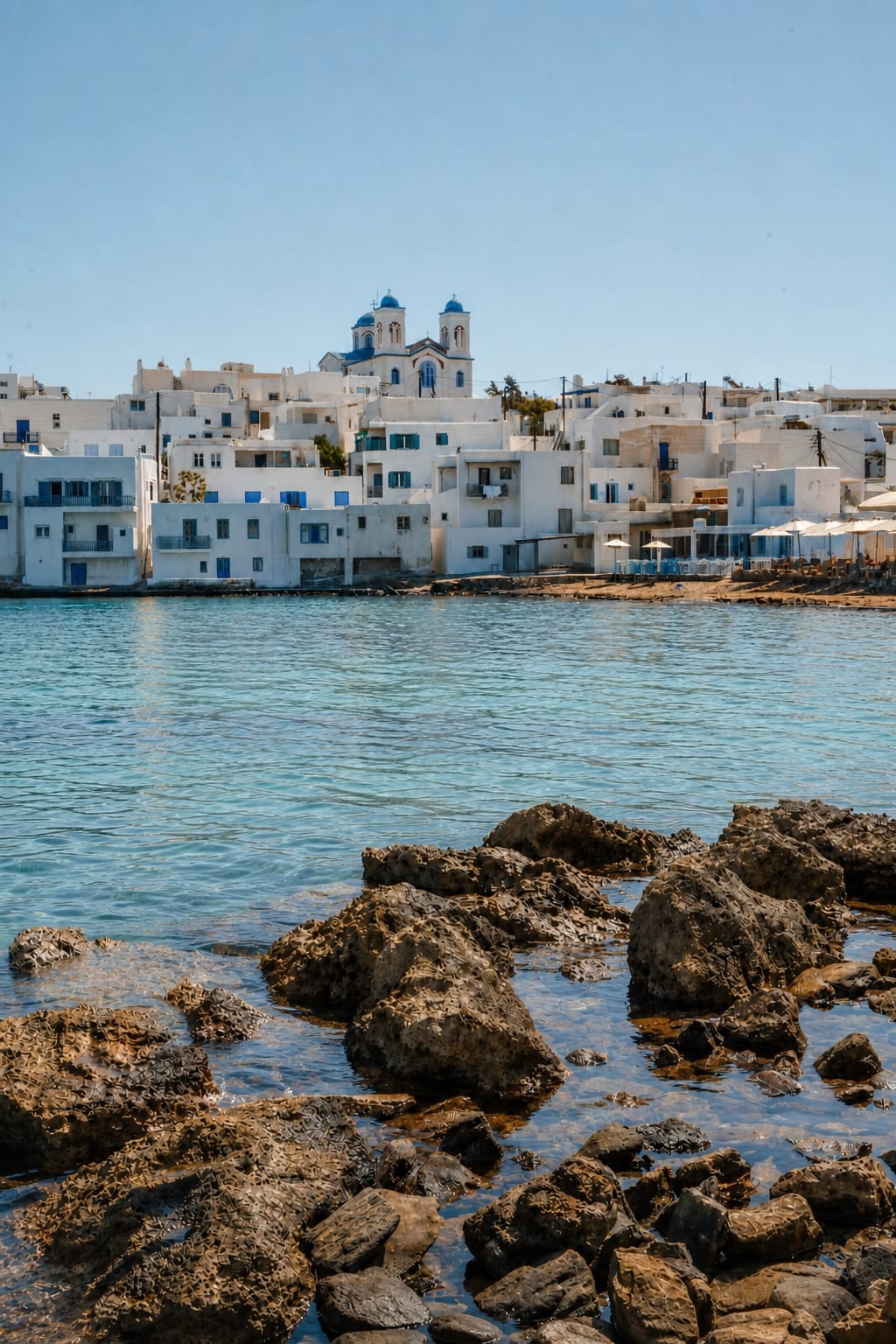 Naoussa Marina in Paros with fishing boats and waterfront tavernas.