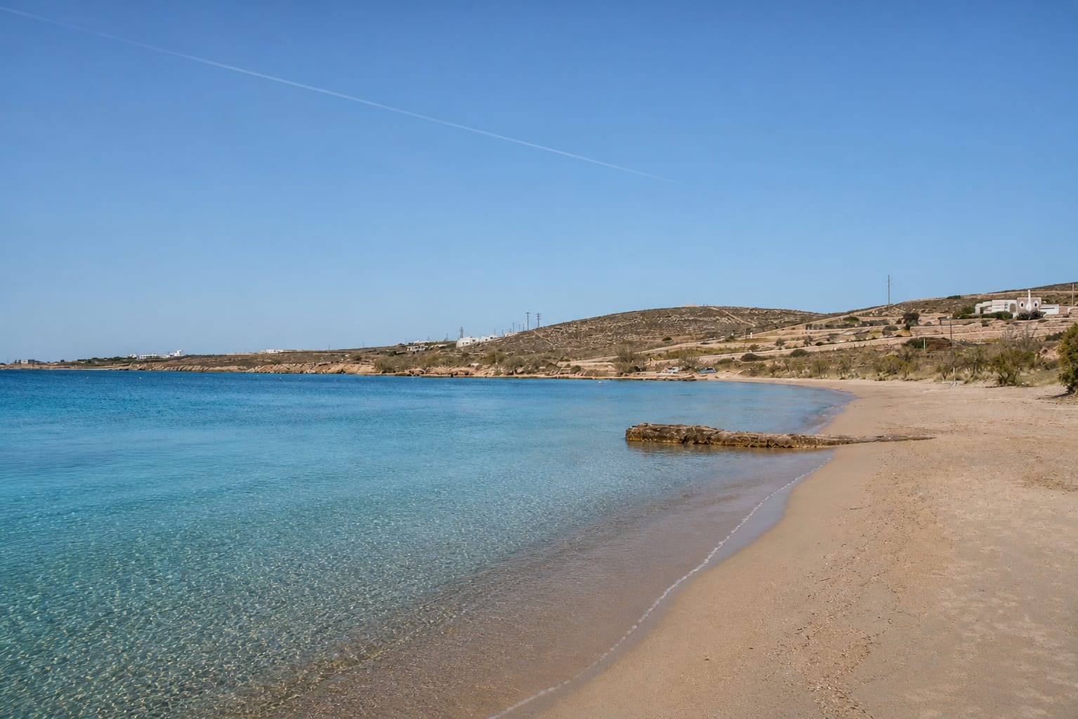 Marcello Beach on Paros with sandy shore and clear blue water