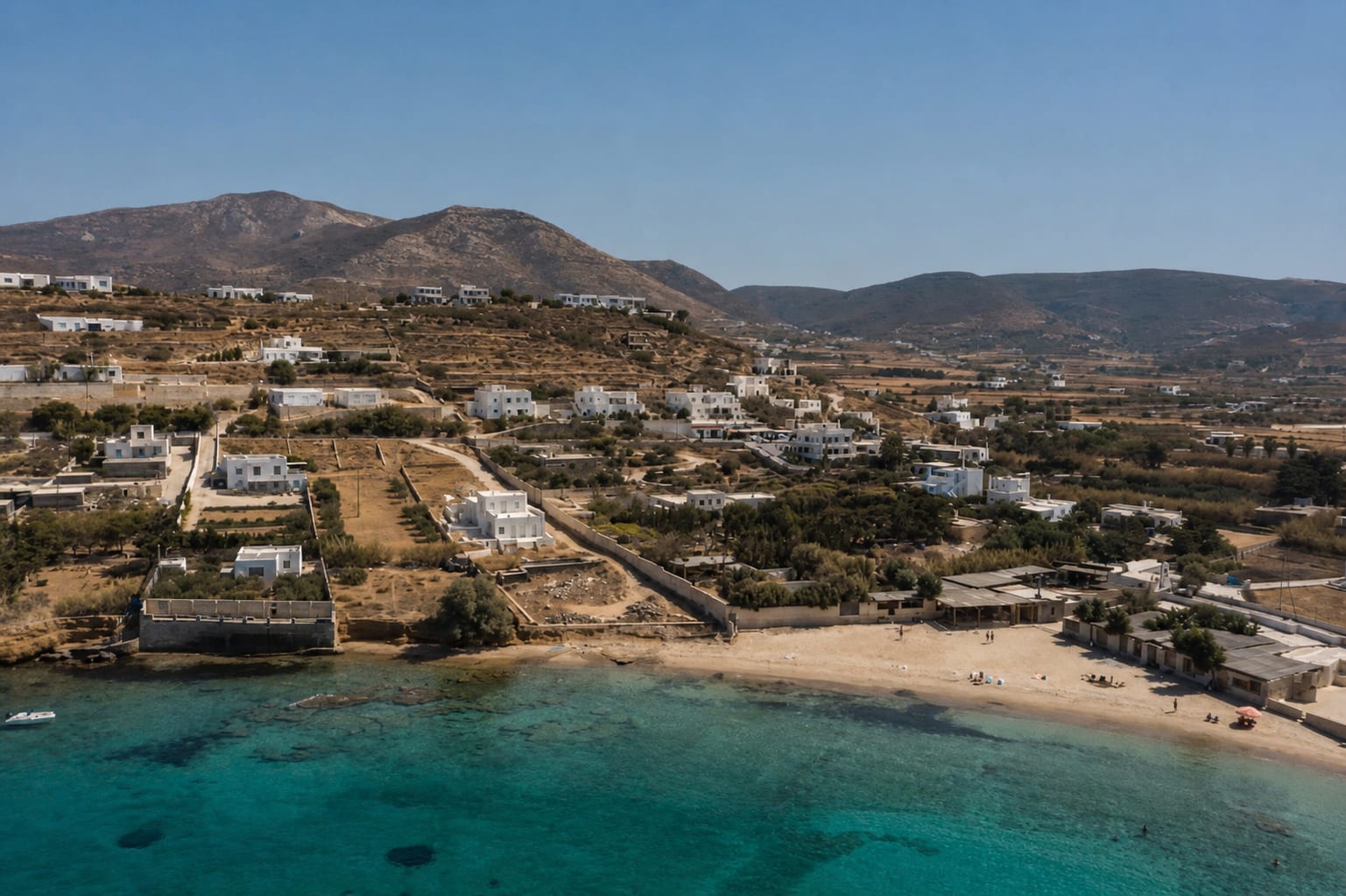 Parasporos Beach on Paros with open shoreline and Aegean views