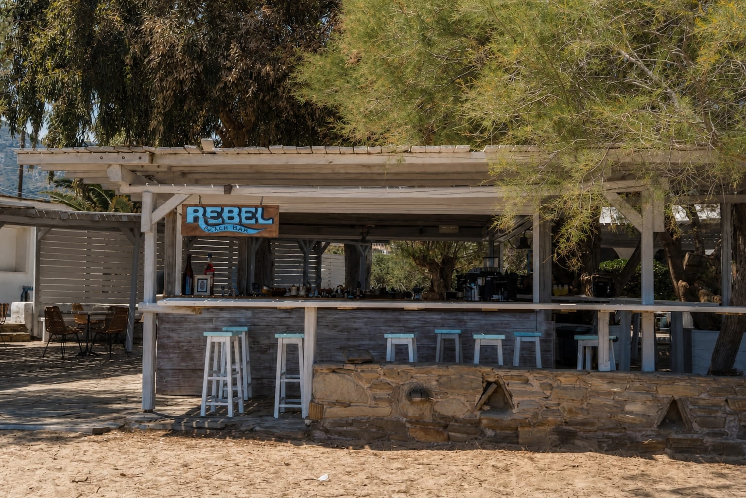 Rebel Beach Bar on Paros with seaside seating by the coast