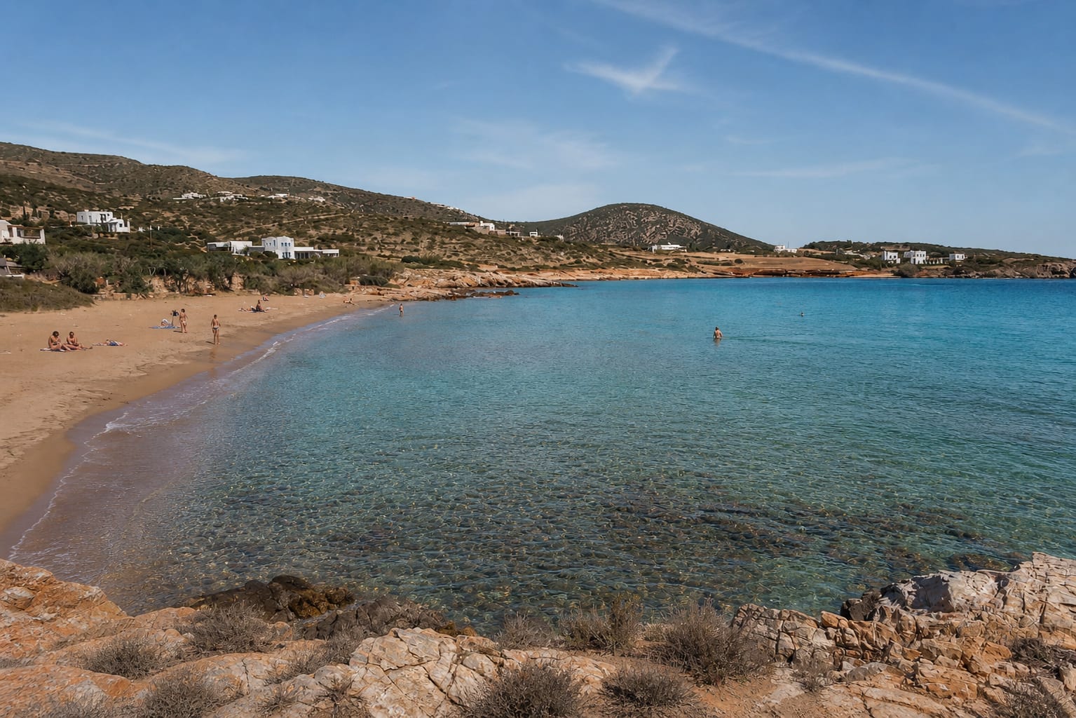 Faragas Beach Bar on Paros with sunbeds by the shoreline