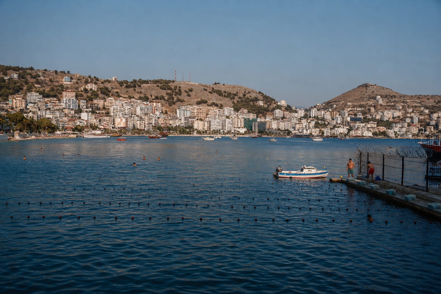 Sea swimming pool with lanes near Sarandë port area.