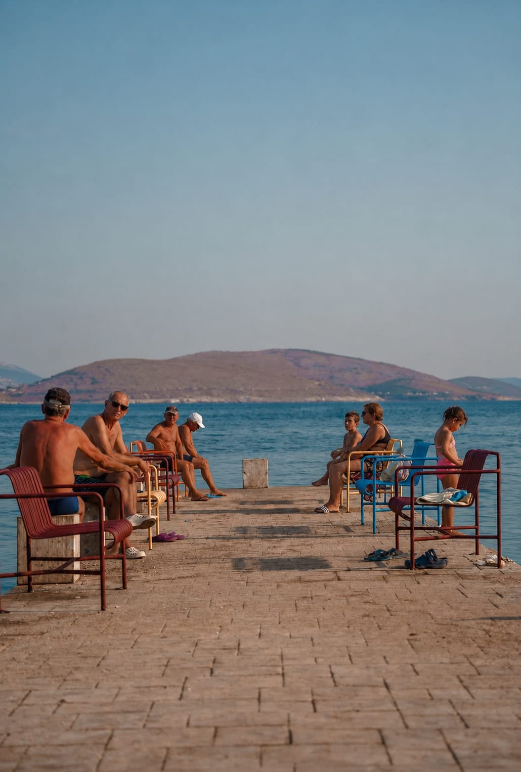 Sunny waterfront promenade in Sarandë along the Albanian coast.