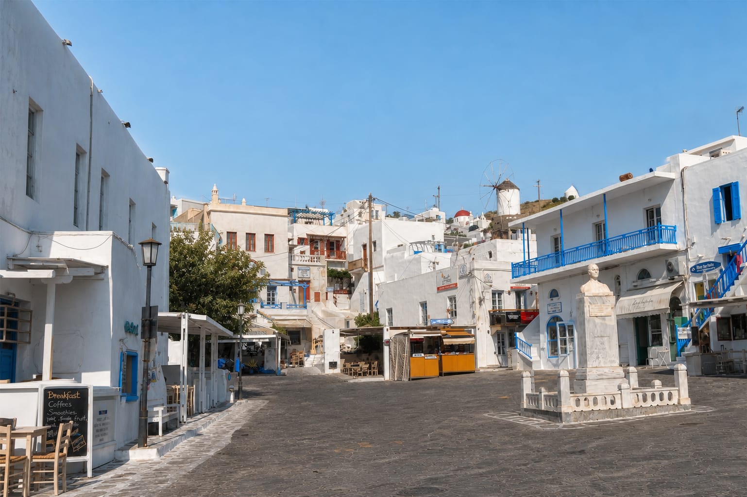 Taxis parked along a street in Mykonos old town.