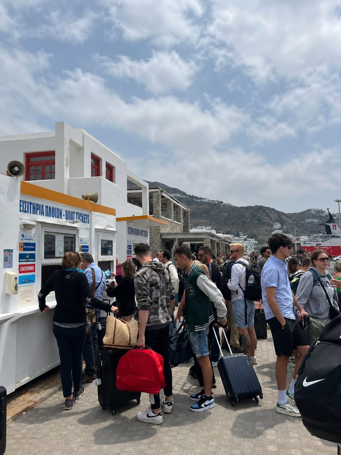 Passenger crowds at the ferry port in Mykonos.