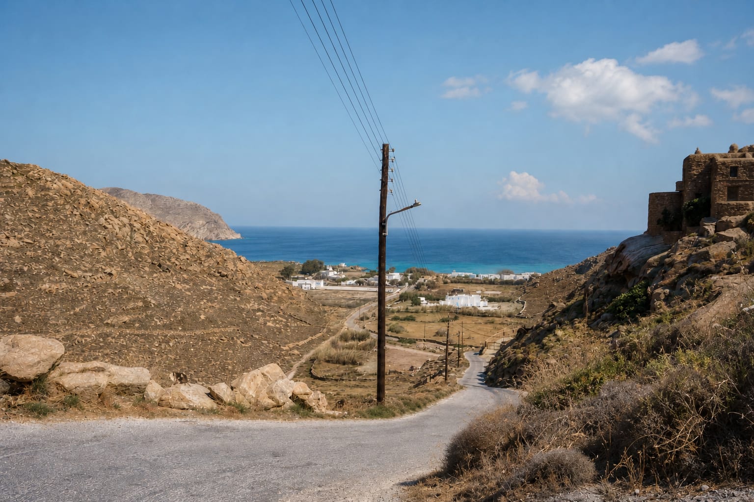 Steep road for driving a rental car in Mykonos.